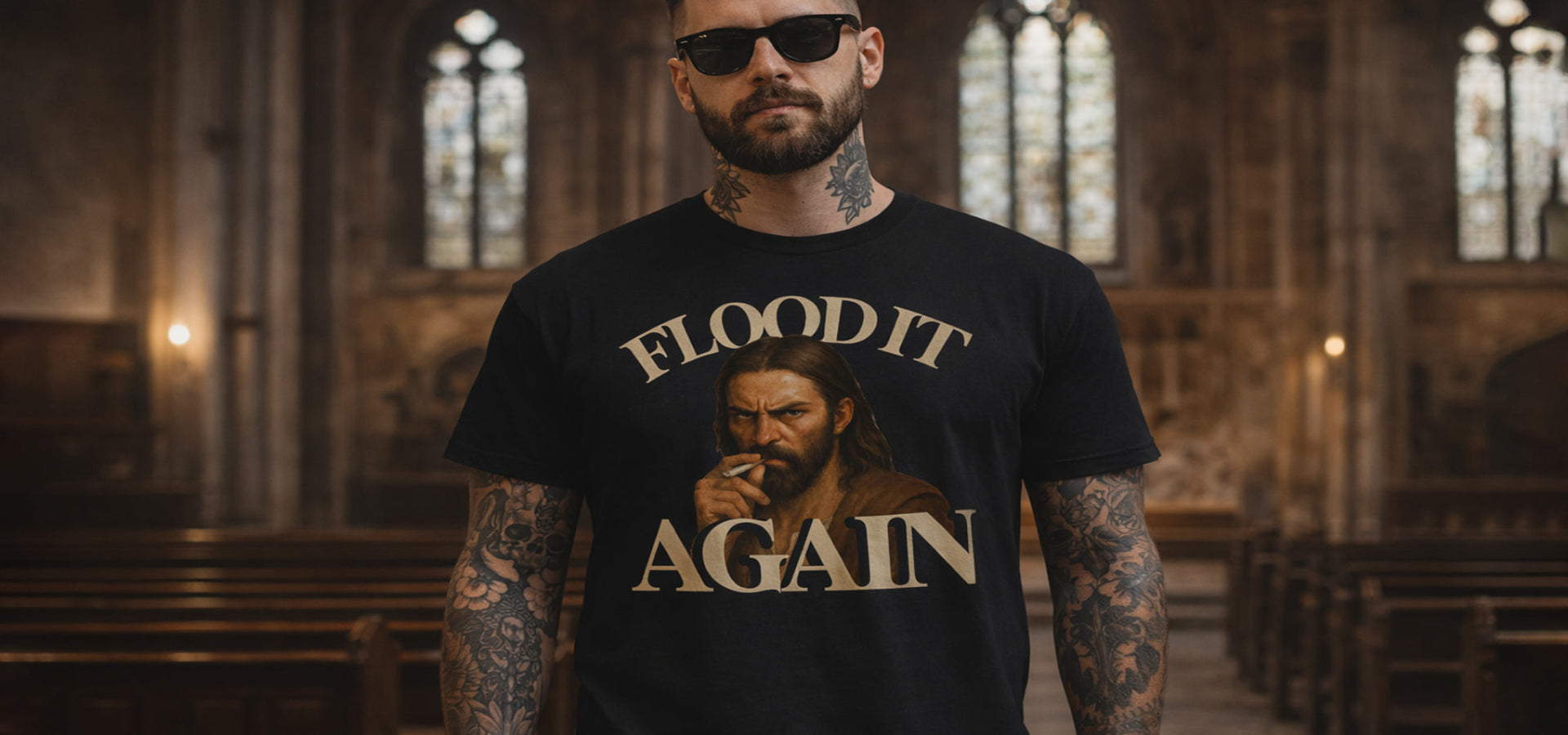 Man wearing a black t-shirt with graphic design and text in a church setting