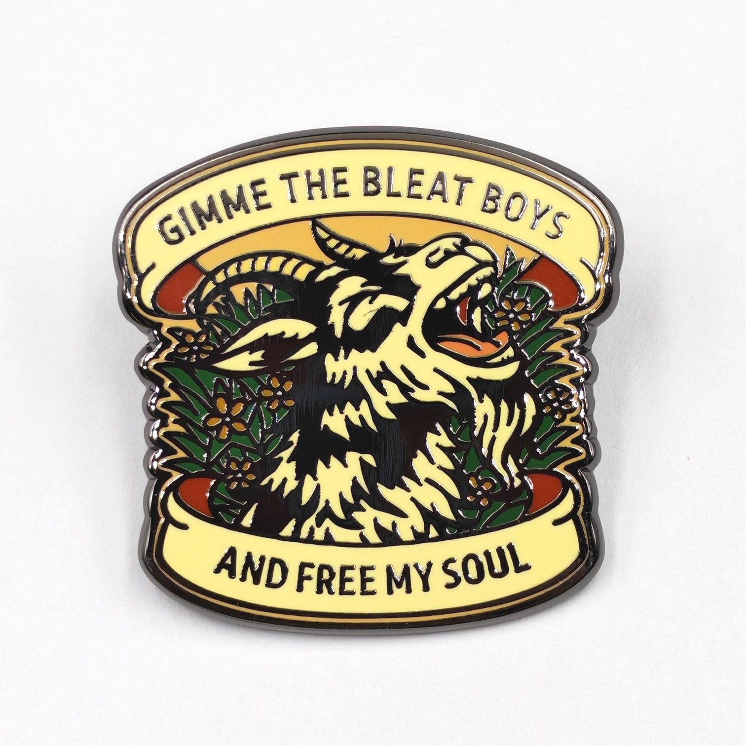 Enamel pin with a goat design and text on a white background
