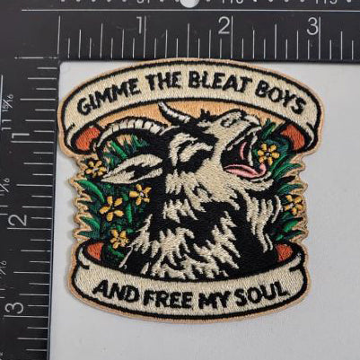 Embroidered patch with goat design and text 'Gimme the Bleat Boys and Free My Soul' on a white background with ruler for scale.