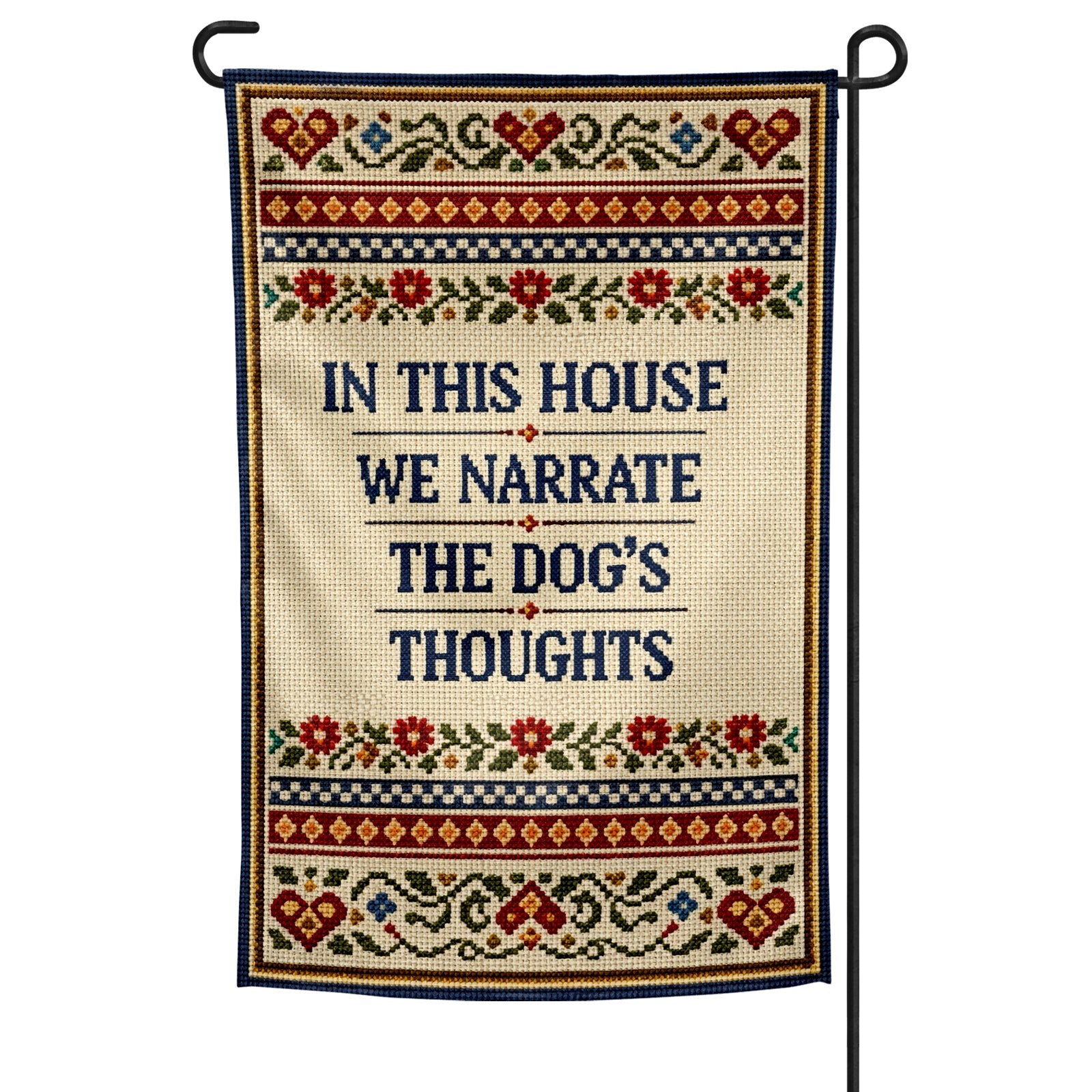Decorative garden flag with text 'In this house we narrate the dog's thoughts' on a white background