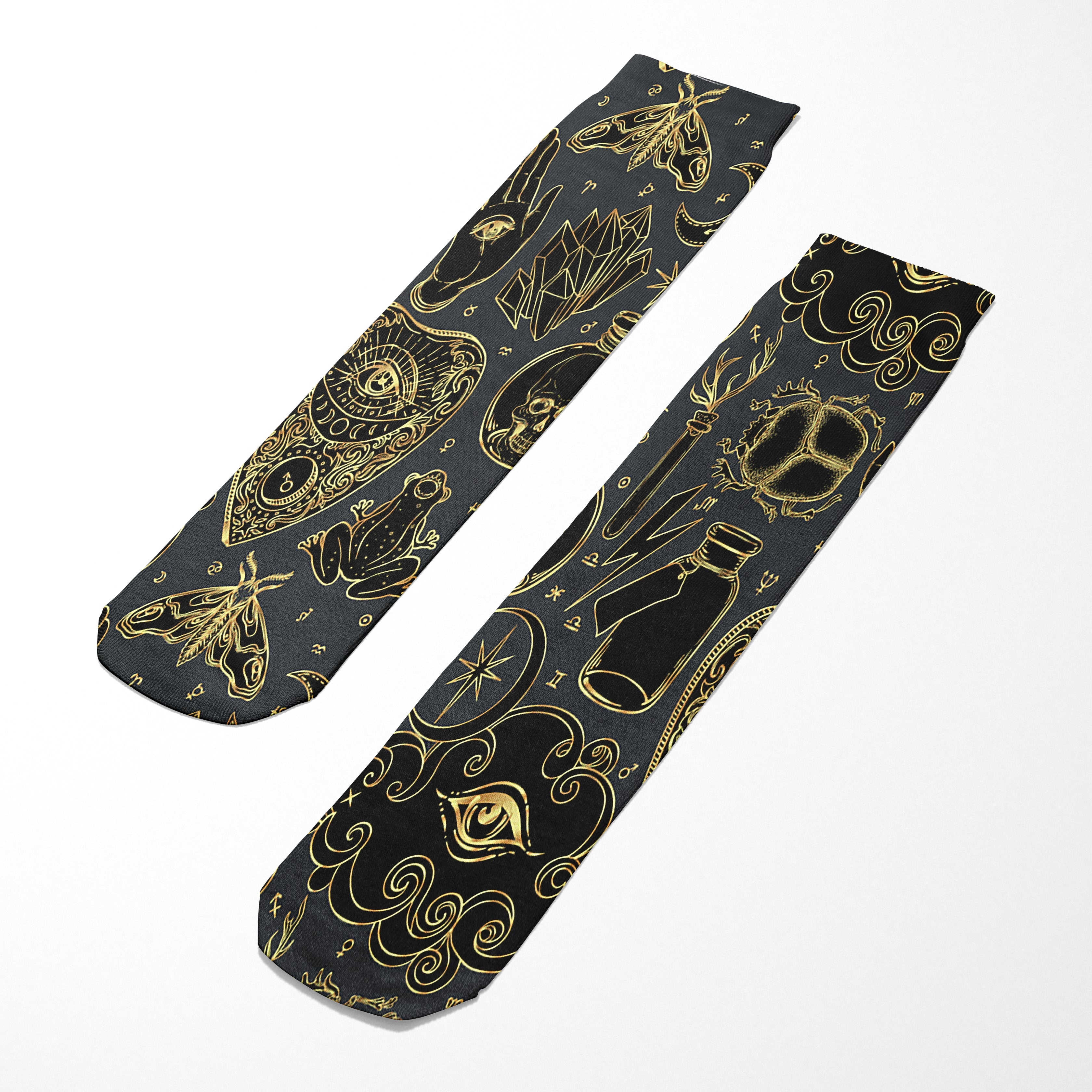 Two black ties with gold patterns on a white background