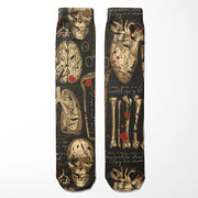 Pair of socks with skull and bone design on a black background