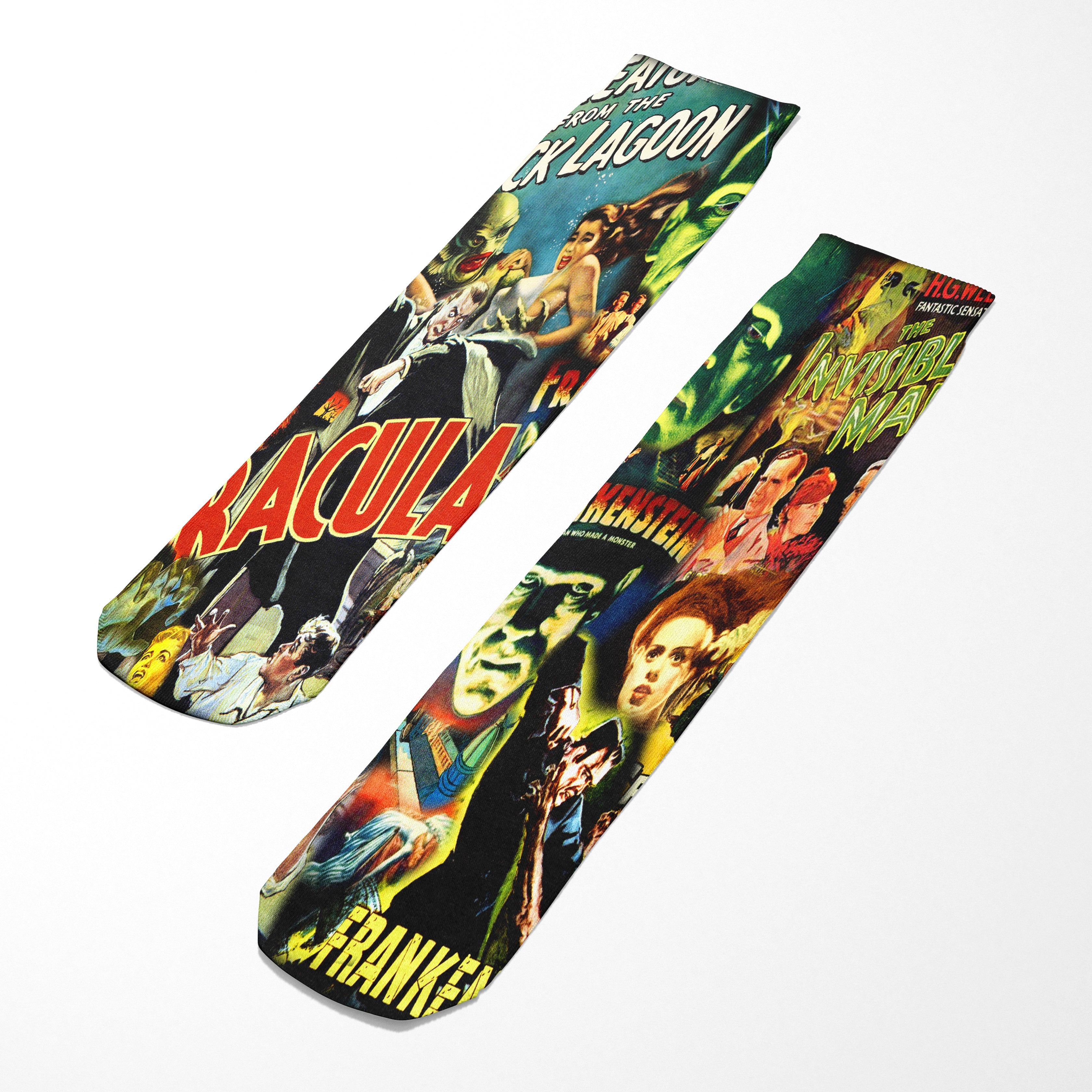 Two socks with vintage monster movie poster designs on a white background