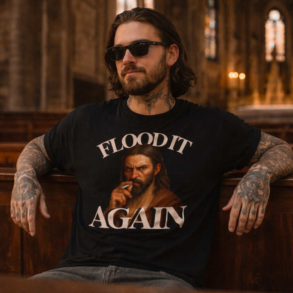 Man wearing a t-shirt with a graphic and text, sitting in a church pew.